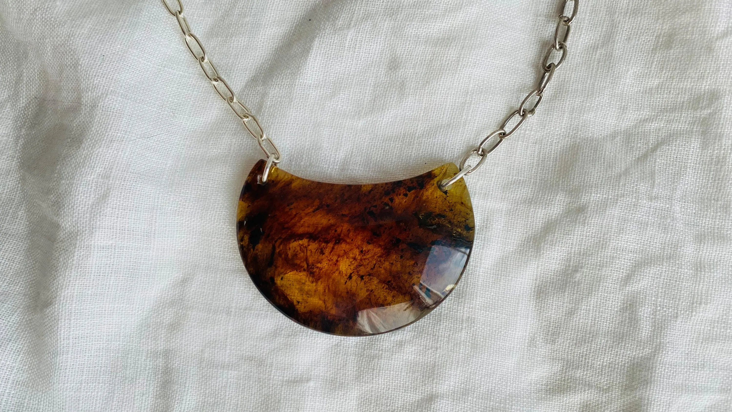 Amber Pendant on a Silver Chain. 0148